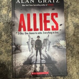 Scholastic Hardcover Book with Red and Black Accents